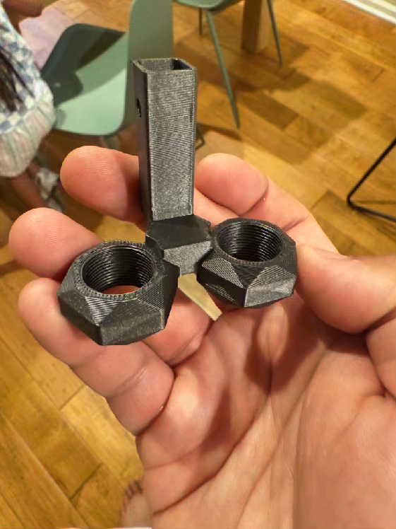 Hand holding early Big Nutz prototypes